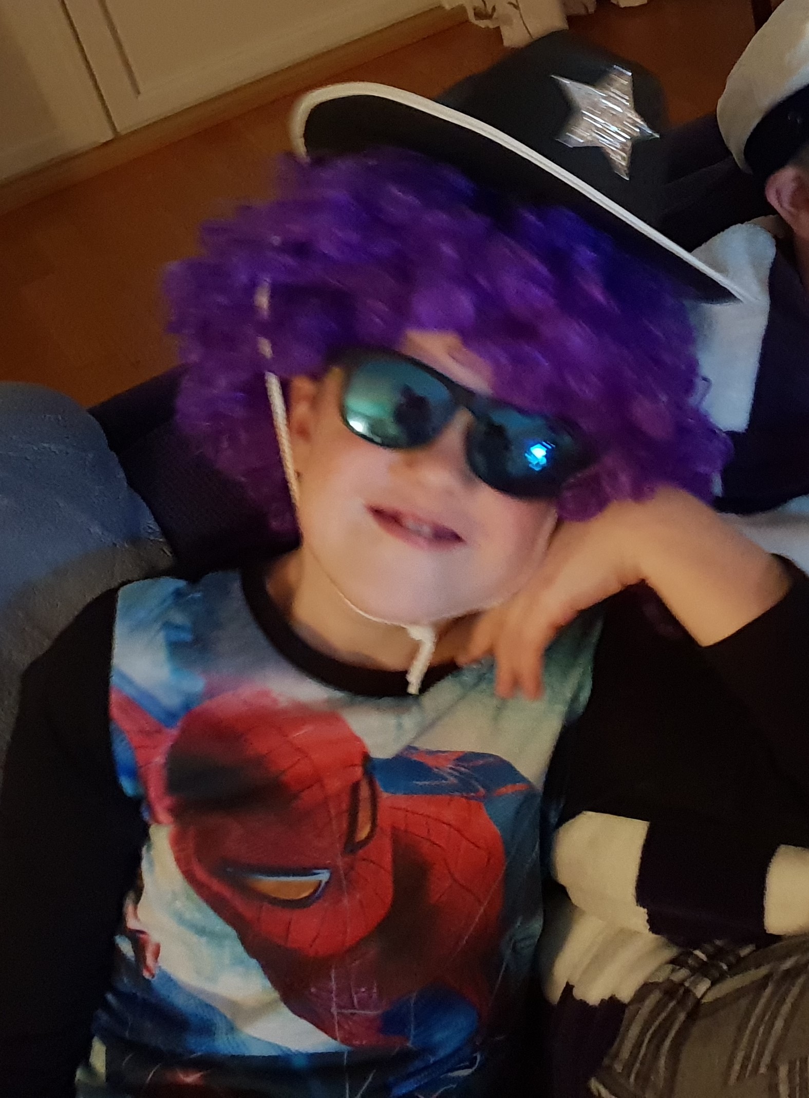 my youngest son testing out a clown wig and some shades